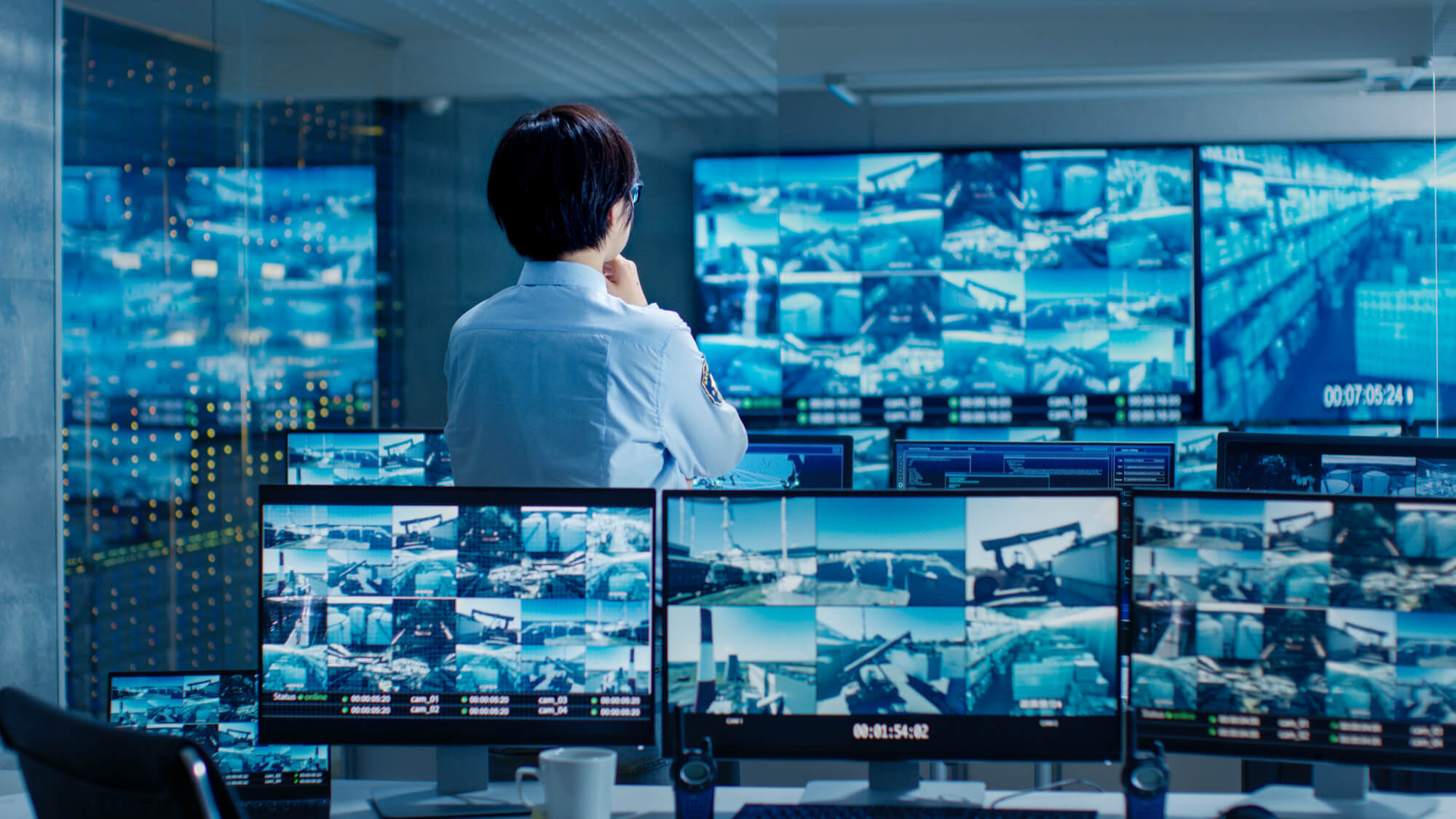 A security expert overlooking surveillance footage